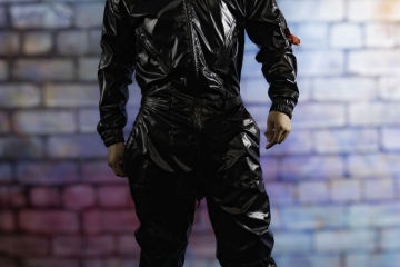 andyscorpiox poses in glossy TwinkX PVC flight suit at Grabbys 2026